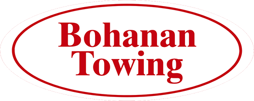 Bohanan Towing TX Logo Flatbed Tow Truck Transporting Vehicles
