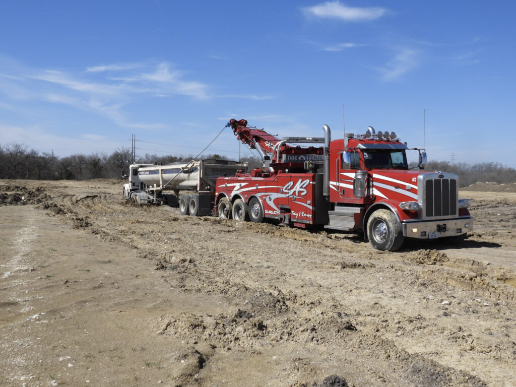 Winching service Temple TX pulling stuck vehicle from ditch